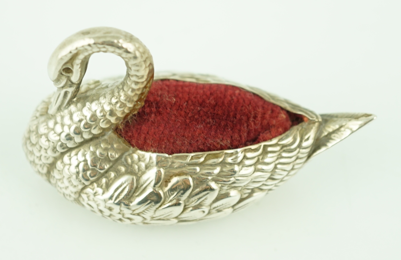 An Edwardian novelty silver pin cushion, modelled as a swan, Adie & Lovekin Ltd